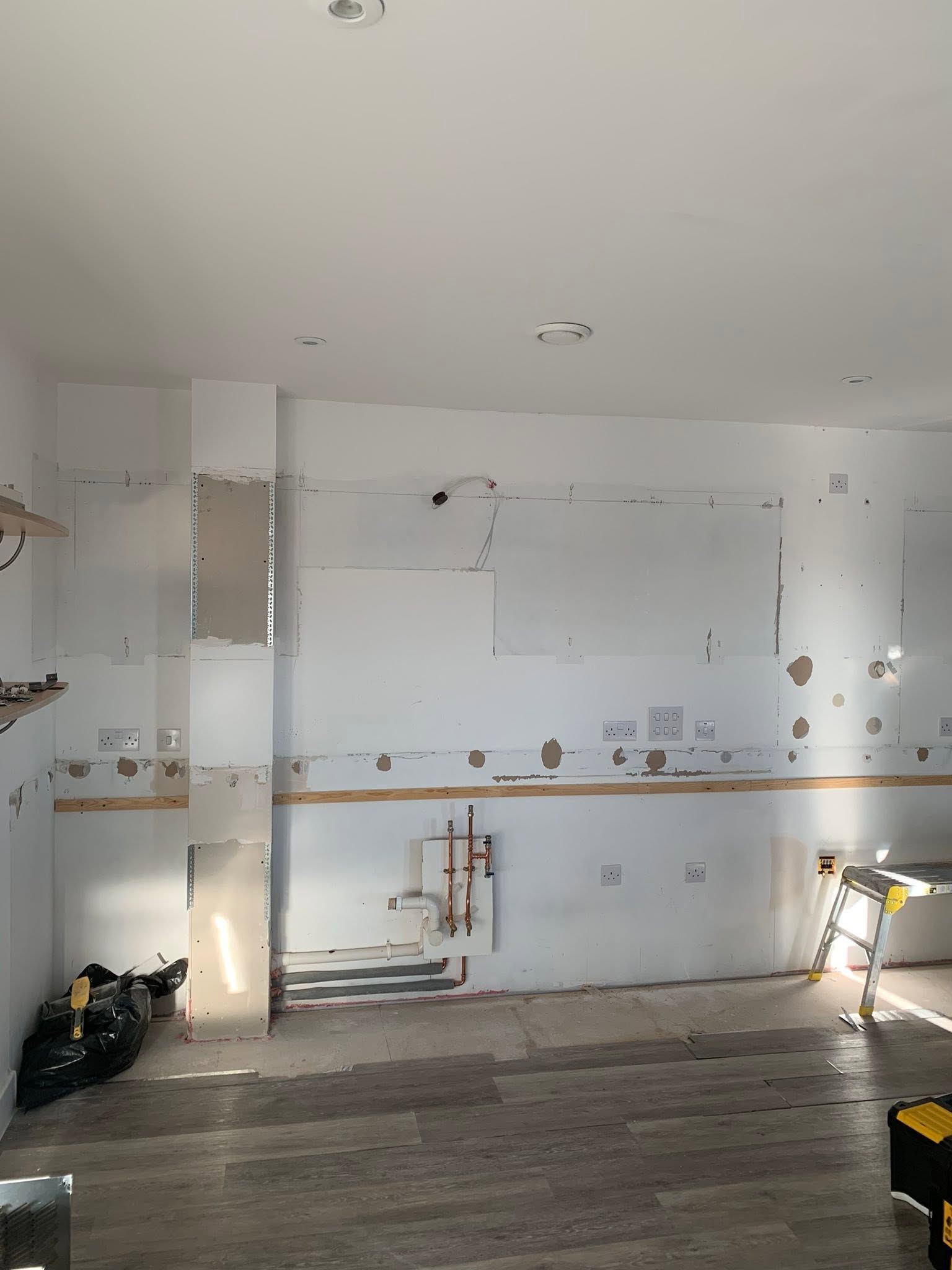 Old kitchen stripped out back to bare walls